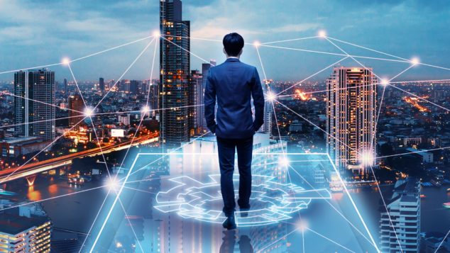 Business technology concept, Professional business man walking on future network city background and futuristic interface graphic at night, Cyberpunk color style